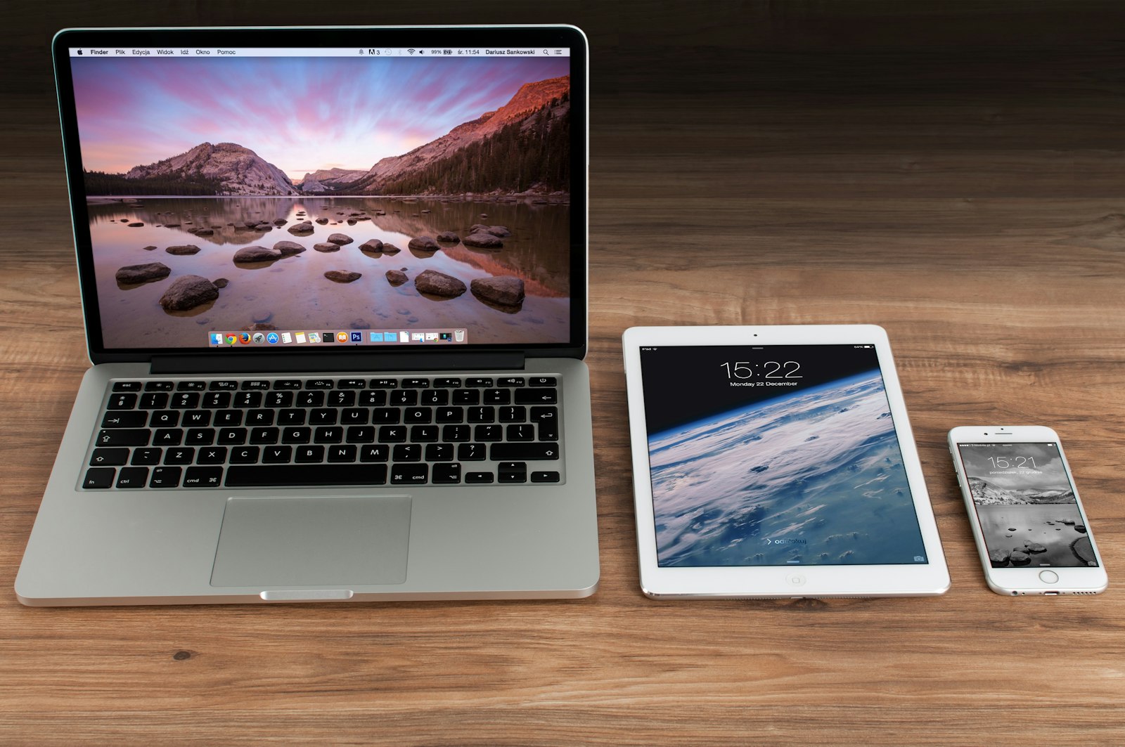 A laptop, tablet and smartphone on a desk showing how a responsive website adapts to each screen size